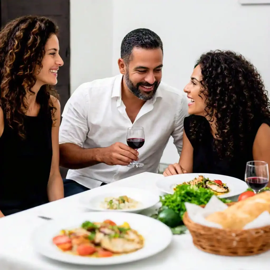 A couple drinking moderate amounts of wine with a healthy meal, illustrating the concept of responsible drinking. Focus on the impact of alcohol on heart.